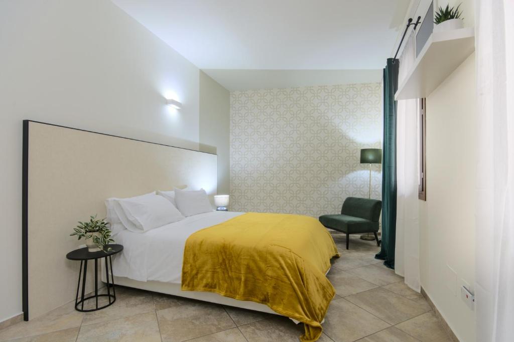 Postel nebo postele na pokoji v ubytování Imola Suites