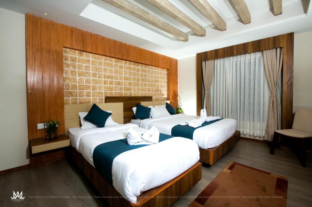 Postel nebo postele na pokoji v ubytování Hotel Maya Boutique & Apartment