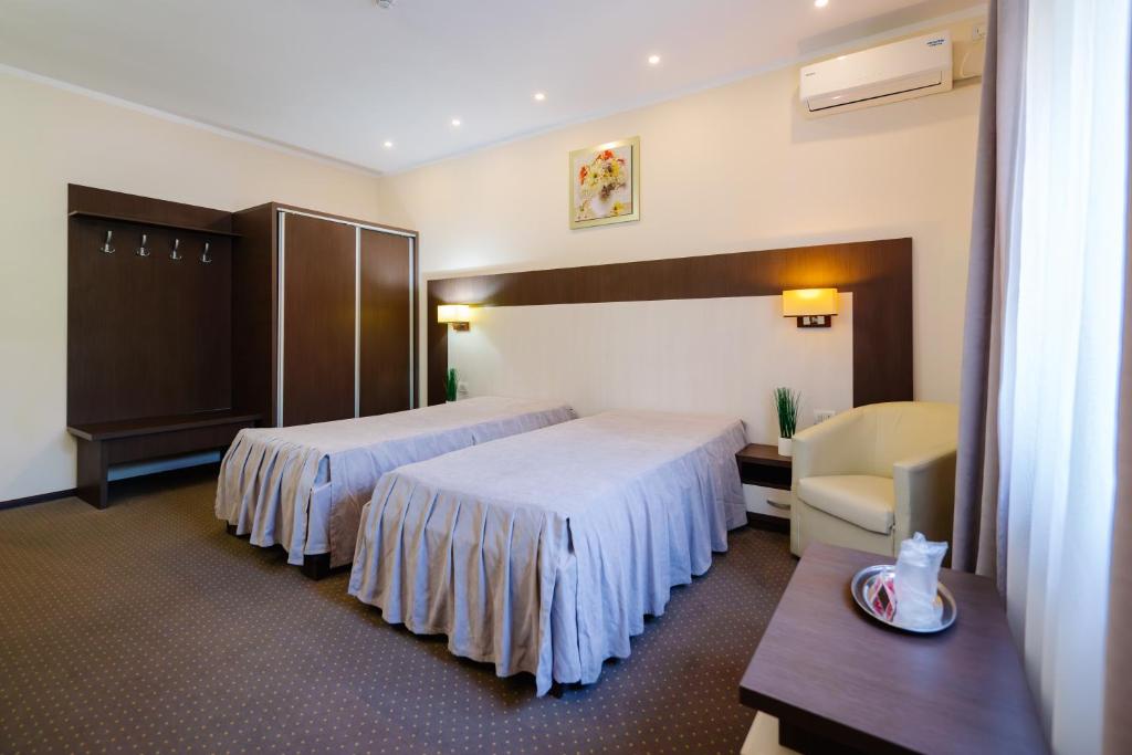 Postel nebo postele na pokoji v ubytování Hotel Evergreen