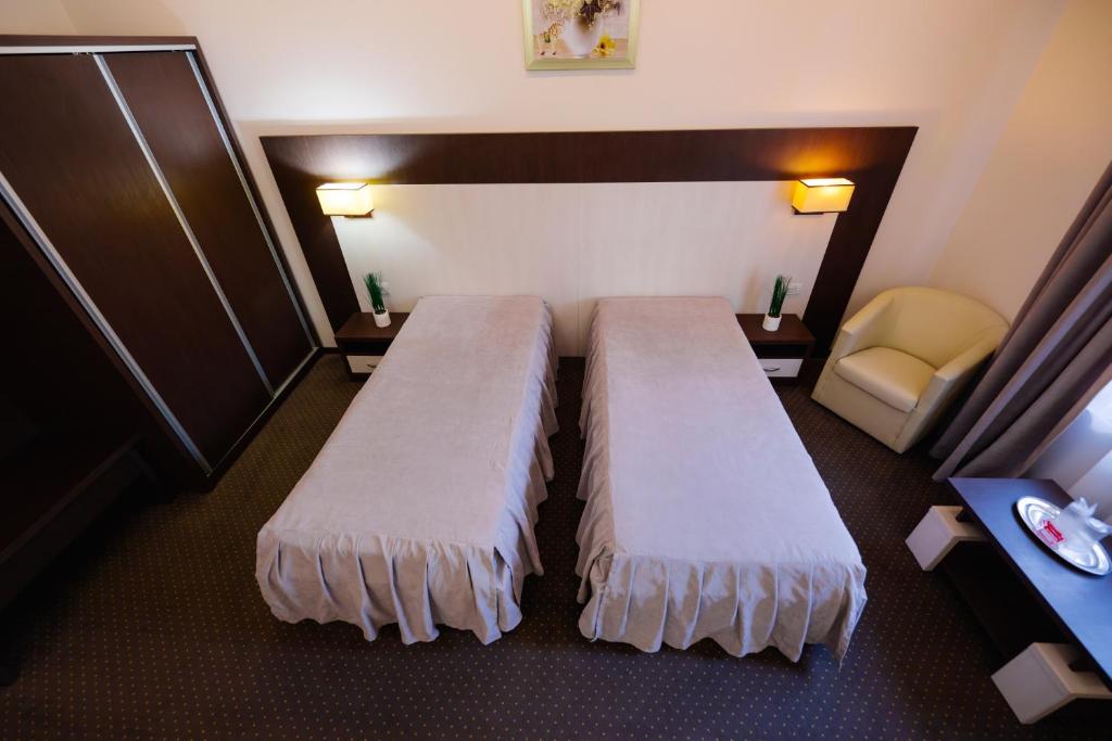Postel nebo postele na pokoji v ubytování Hotel Evergreen