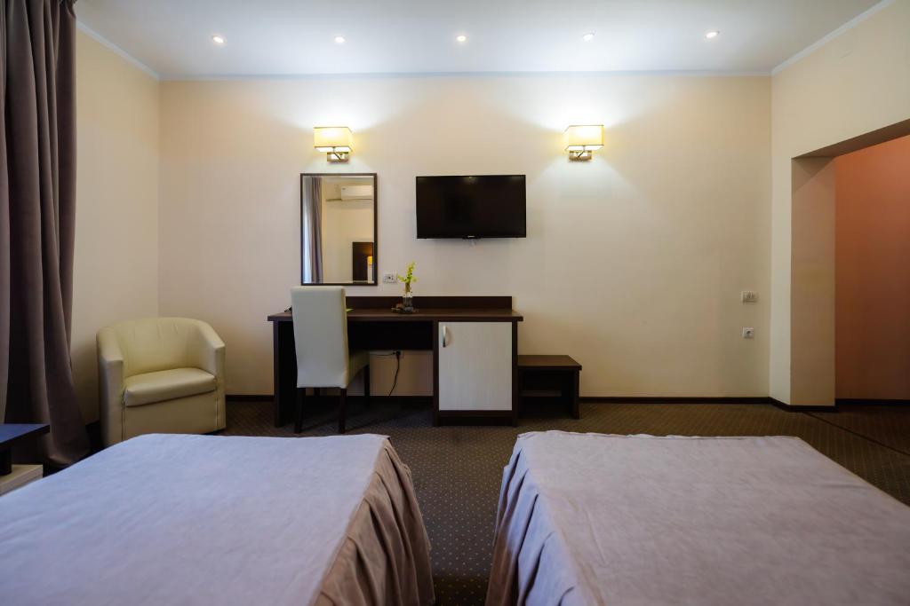 Postel nebo postele na pokoji v ubytování Hotel Evergreen