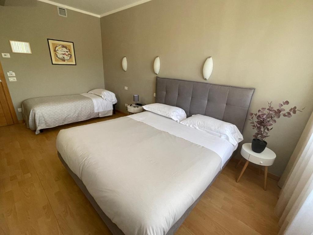 Postel nebo postele na pokoji v ubytování Hotel Rio Umbertide