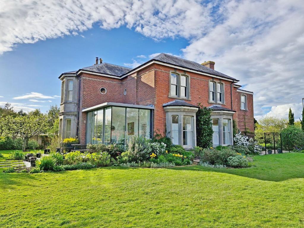 a large brick house with a large yard at Blythe House - Emsworth in Emsworth