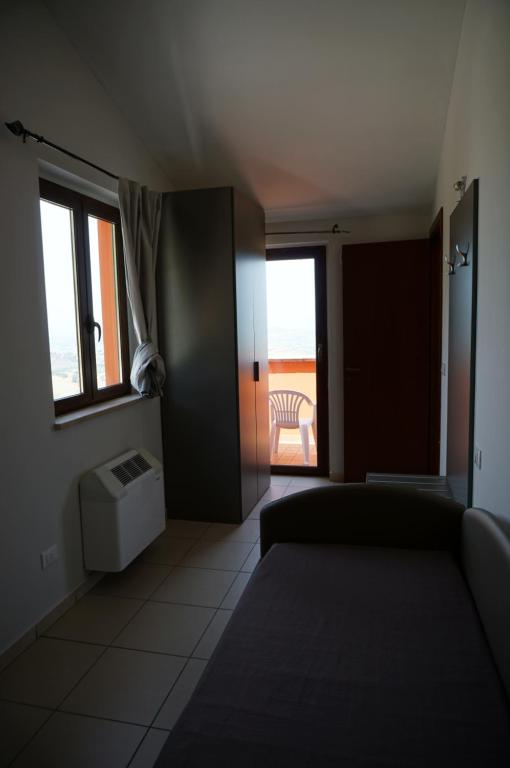Postel nebo postele na pokoji v ubytování La Terrazza Motta