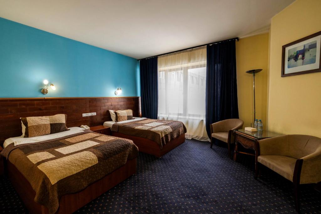 Postel nebo postele na pokoji v ubytování Ararat Hotel