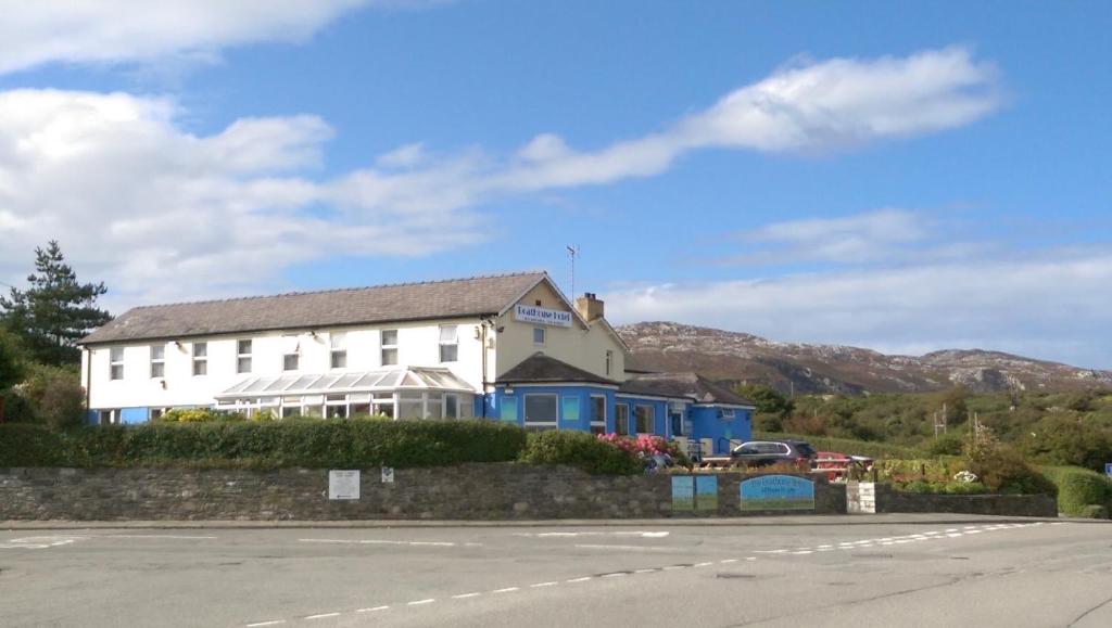 a building on the side of a road at Boathouse Hotel in Holyhead