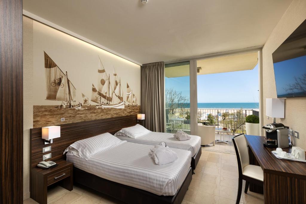 Posteľ alebo postele v izbe v ubytovaní Mercure Rimini Lungomare