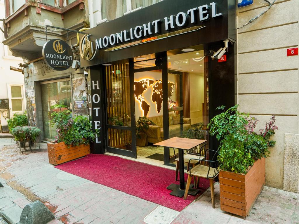 a restaurant with a red rug in front of a building at Moonlight Suit Hotel Taksim in Istanbul