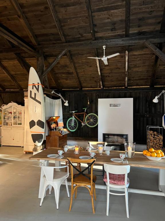 a room with a table and chairs and an airplane at Siedlisko Blanki in Suryty