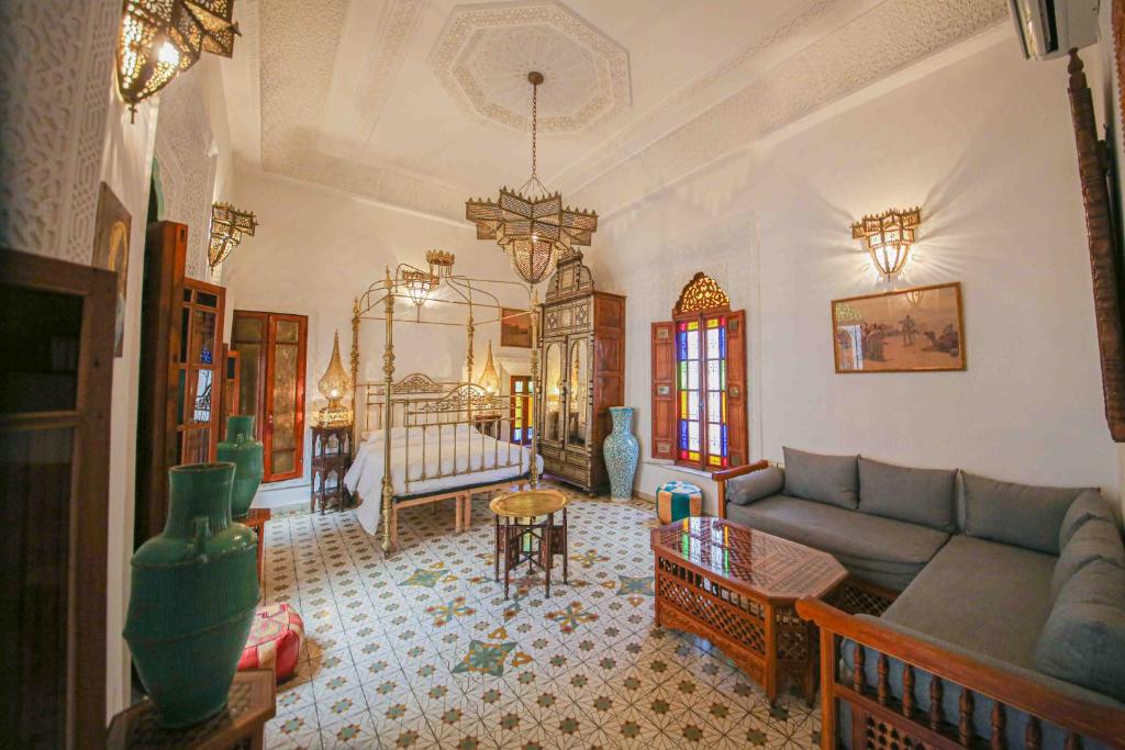 a living room with a couch and a table at Dar Dalila Fes in Fez