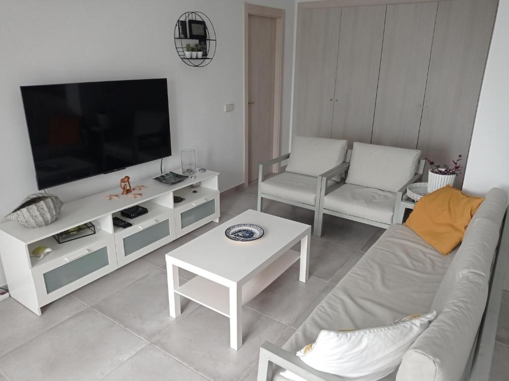 TV a/nebo společenská místnost v ubytování Residencial Xeresa del Monte Solo Familias Serviplaya
