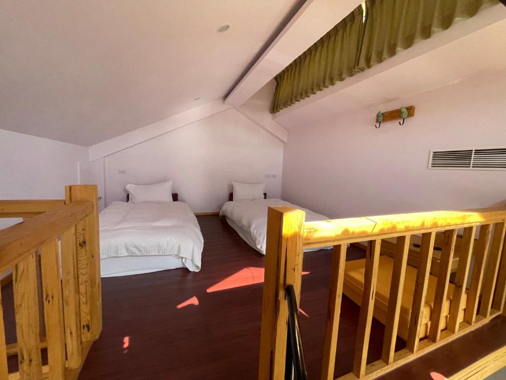 Postel nebo postele na pokoji v ubytování House of Ahan