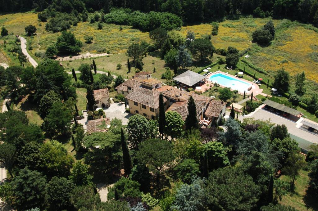 an aerial view of a house with a swimming pool at Villa Rigacci Hotel in Reggello