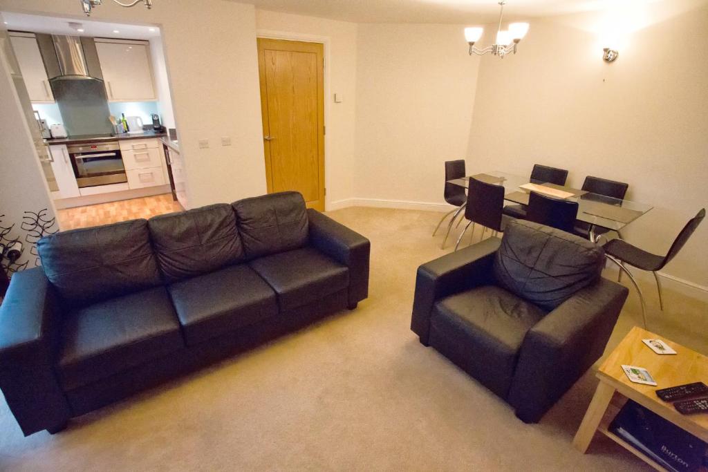 a living room with a couch and a table at Salisbury Luxury Apartment in Salisbury
