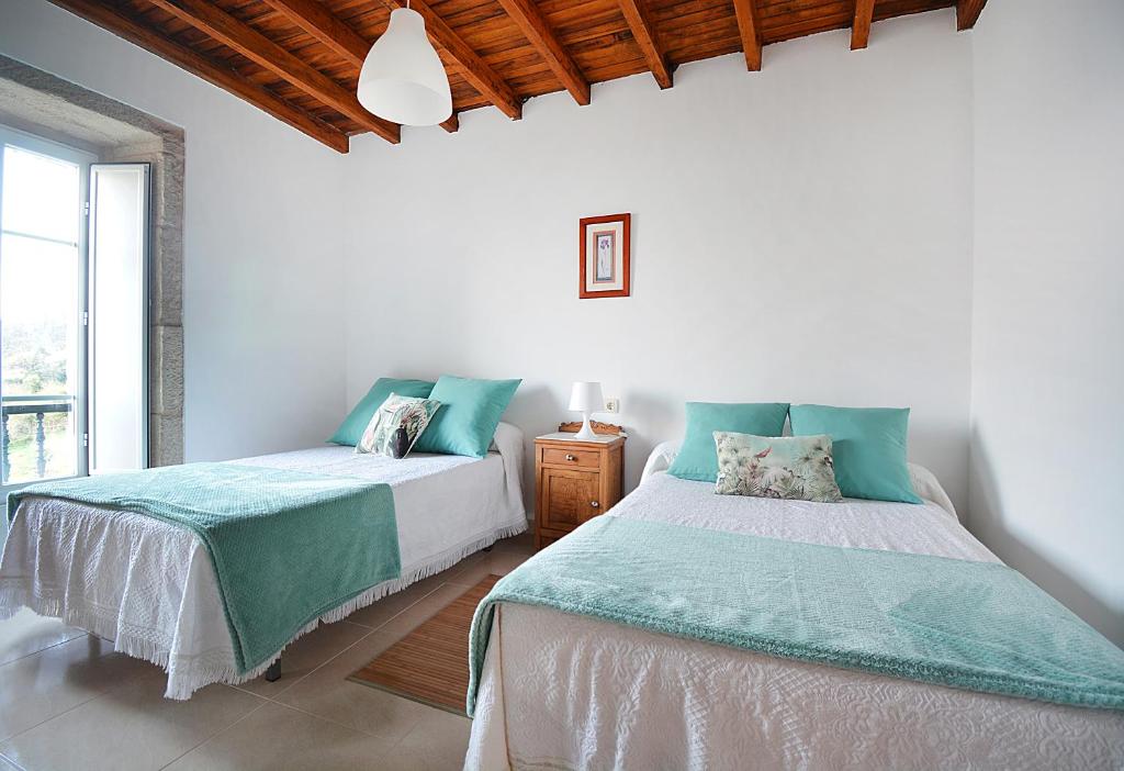 Posteľ alebo postele v izbe v ubytovaní Casa en Muros con preciosas vistas al mar