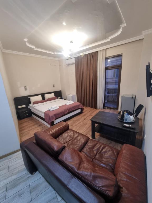 Postel nebo postele na pokoji v ubytování MAHALI HOTEL