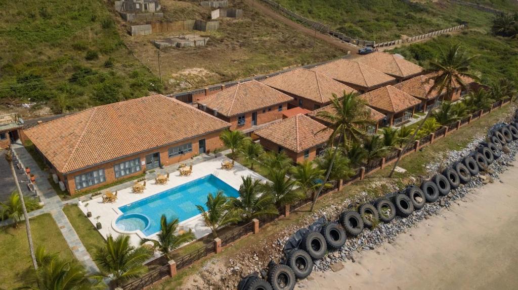an aerial view of a house with a swimming pool at Mankoview Beach Resort in Winneba