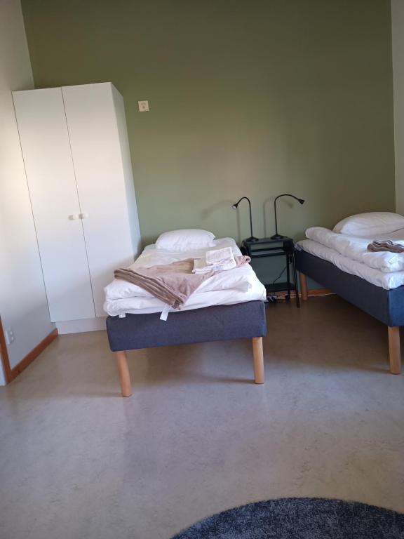 Postel nebo postele na pokoji v ubytování Vandrarhem Dahléns