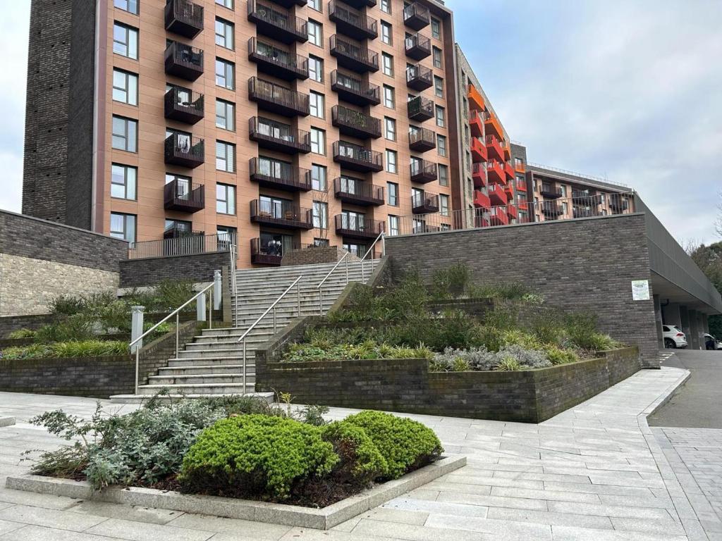 a set of stairs in front of a large building at Captivating 2-Bed Apartment in Maidstone in Maidstone