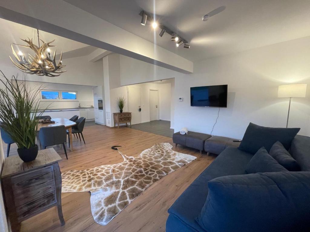 TV a/nebo společenská místnost v ubytování Ferienhaus am Weinberg Krast