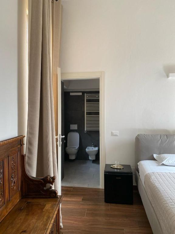 Postel nebo postele na pokoji v ubytování Residenza Scaligera