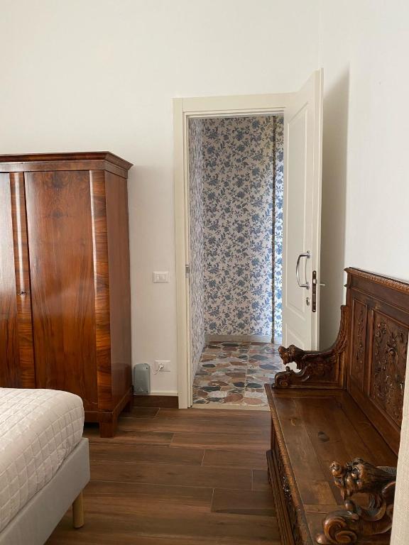 Postel nebo postele na pokoji v ubytování Residenza Scaligera
