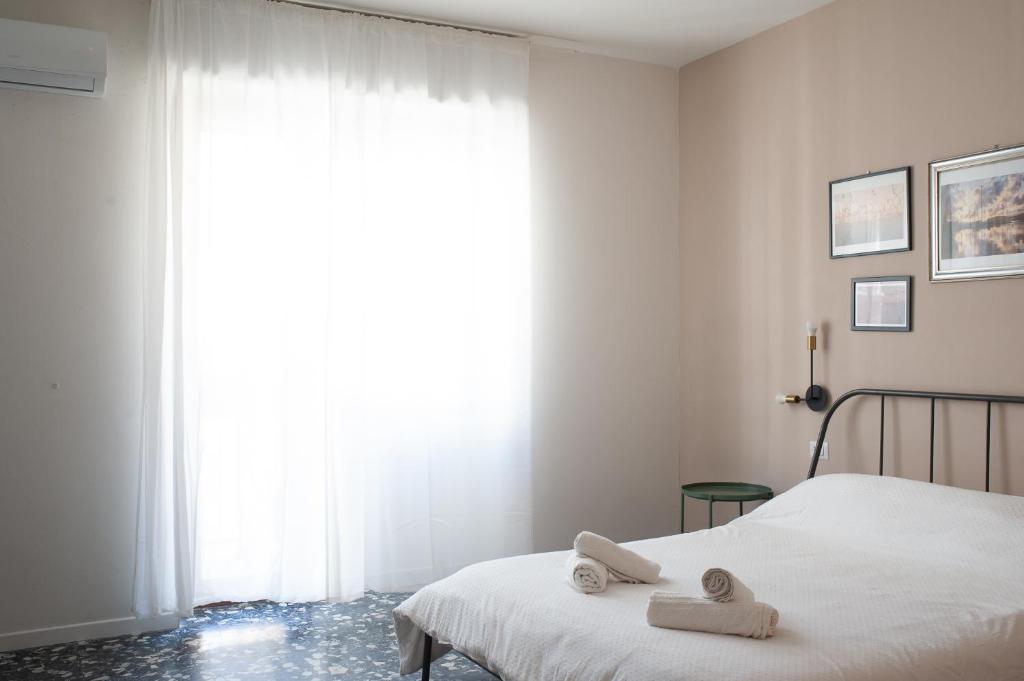 Postel nebo postele na pokoji v ubytování Four Rooms Alghero