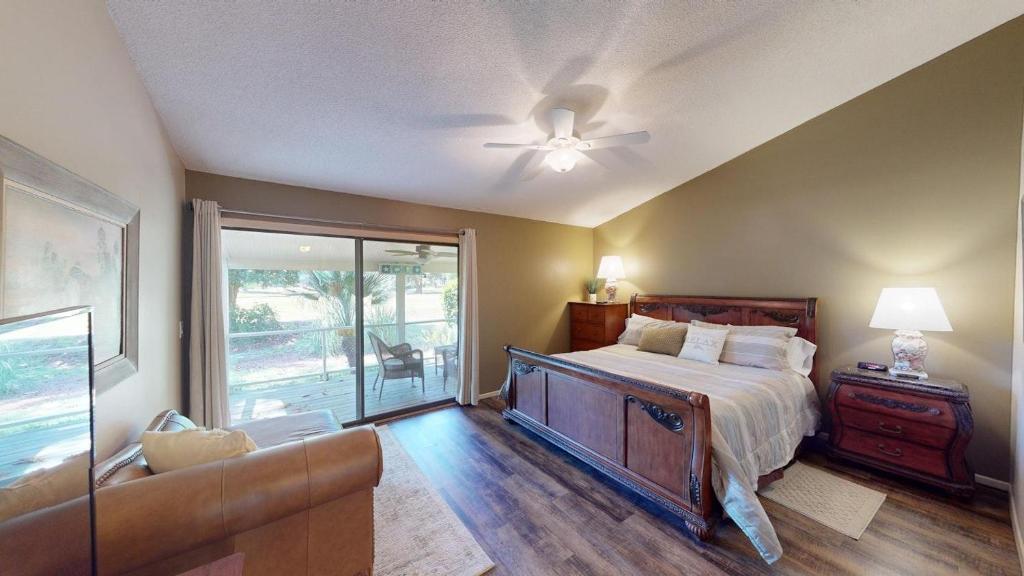 a bedroom with a bed and a ceiling fan at Escape to Magnolia Run 2 Bedroom Golf Villa in Pawleys Island