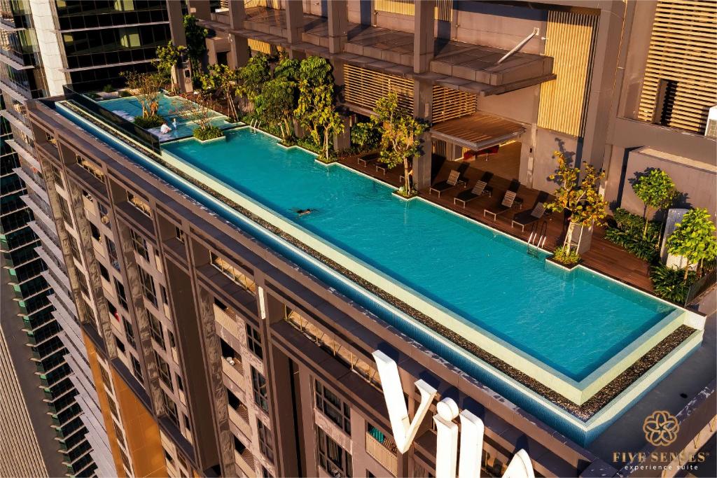 an overhead view of a swimming pool on top of a building at ViiA Residence, Mid Valley KL in Kuala Lumpur