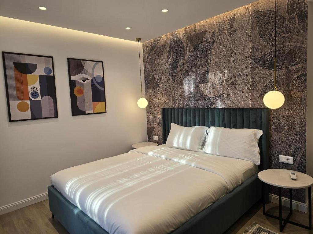 Postel nebo postele na pokoji v ubytování Perla Hotel