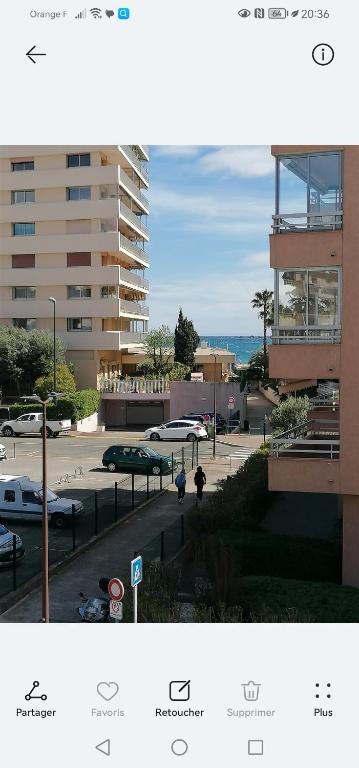 a view of a parking lot with cars in a parking lot at Chez Éric in Fréjus