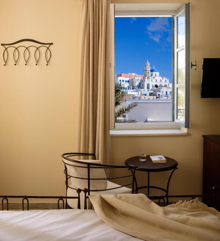 Letto o letti in una camera di Ikio Concept Santorini