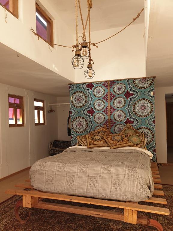 a bedroom with a bed on a wooden platform at Das! Boot auf dem Meer in Safaga 