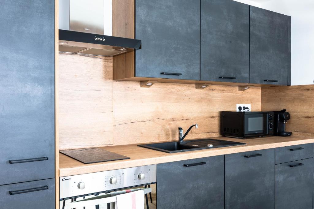 Kuchyňa alebo kuchynka v ubytovaní Duplex Standing - Hyper Centre - Tout équipé