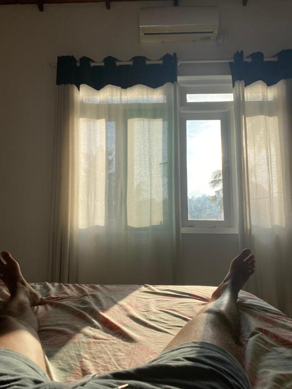 Postel nebo postele na pokoji v ubytování Kande Home