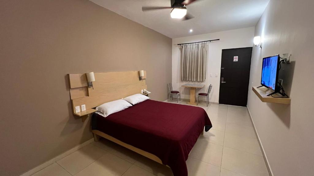 Postel nebo postele na pokoji v ubytování Nova Hotel