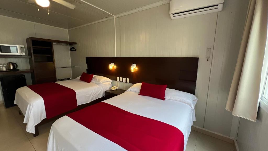 Postel nebo postele na pokoji v ubytování Nova Hotel