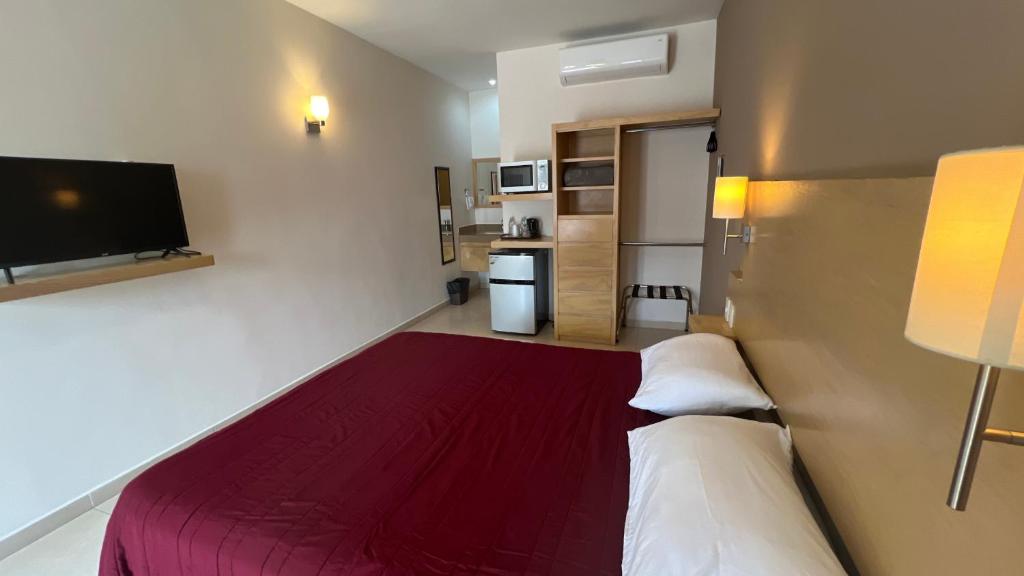 Postel nebo postele na pokoji v ubytování Nova Hotel