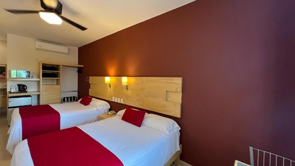 Postel nebo postele na pokoji v ubytování Nova Hotel