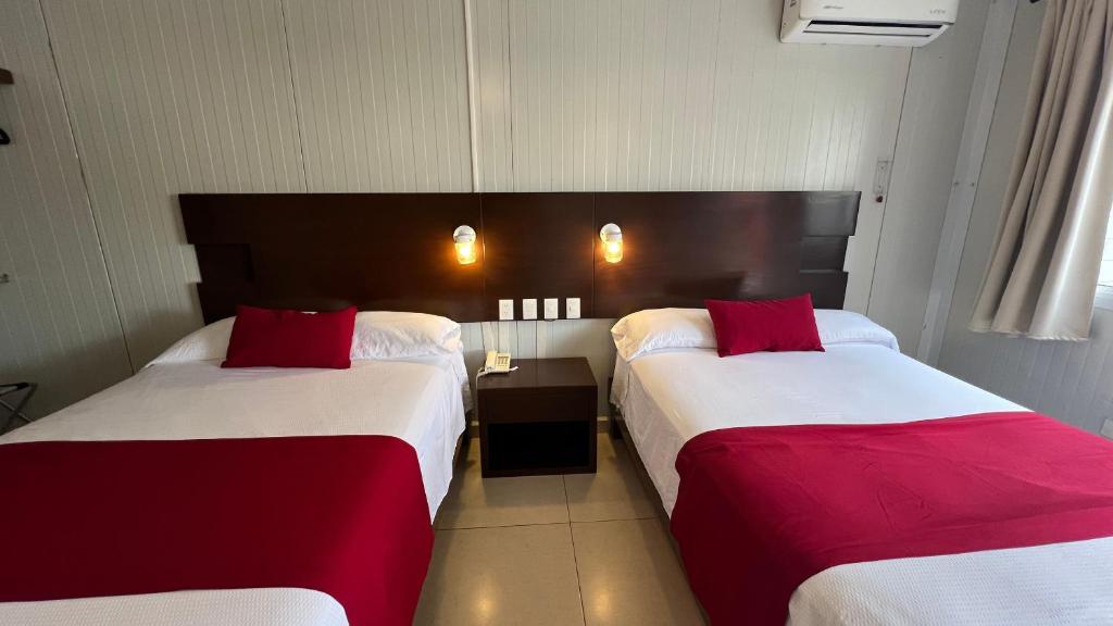 Postel nebo postele na pokoji v ubytování Nova Hotel