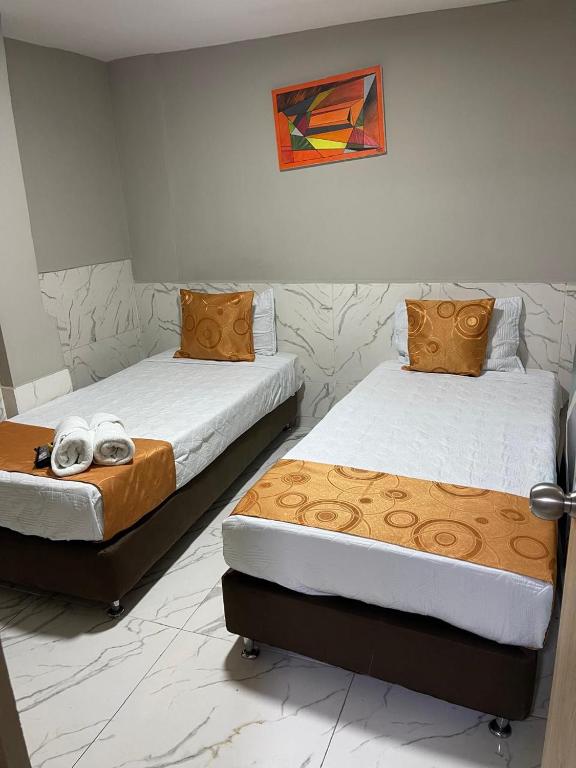 Postel nebo postele na pokoji v ubytování HOTEL LUXEM