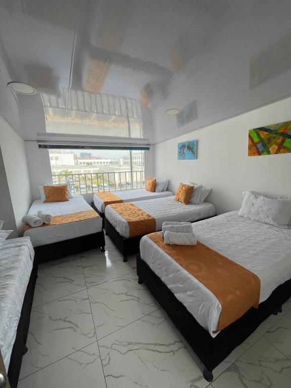 Postel nebo postele na pokoji v ubytování HOTEL LUXEM