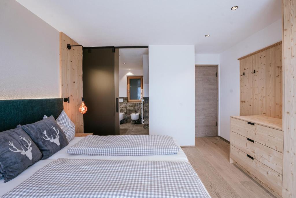Postel nebo postele na pokoji v ubytování Chalets Hansleitner