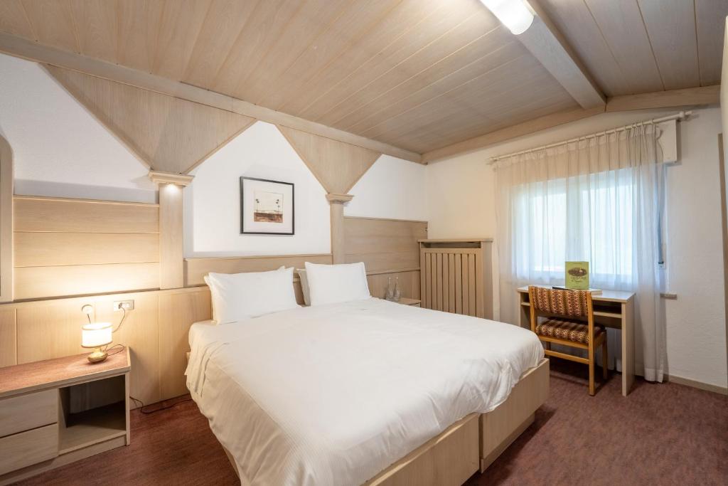 Łóżko lub łóżka w pokoju w obiekcie Hotel Grohmann