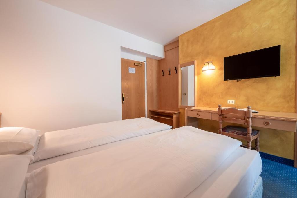 Łóżko lub łóżka w pokoju w obiekcie Hotel Grohmann