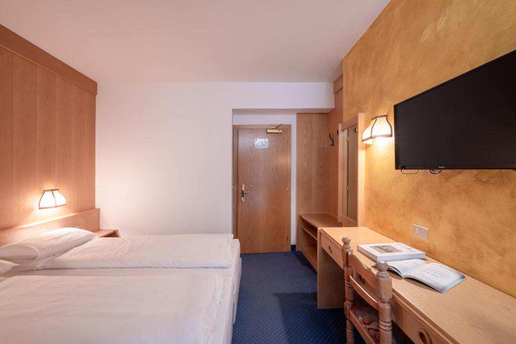 Łóżko lub łóżka w pokoju w obiekcie Hotel Grohmann