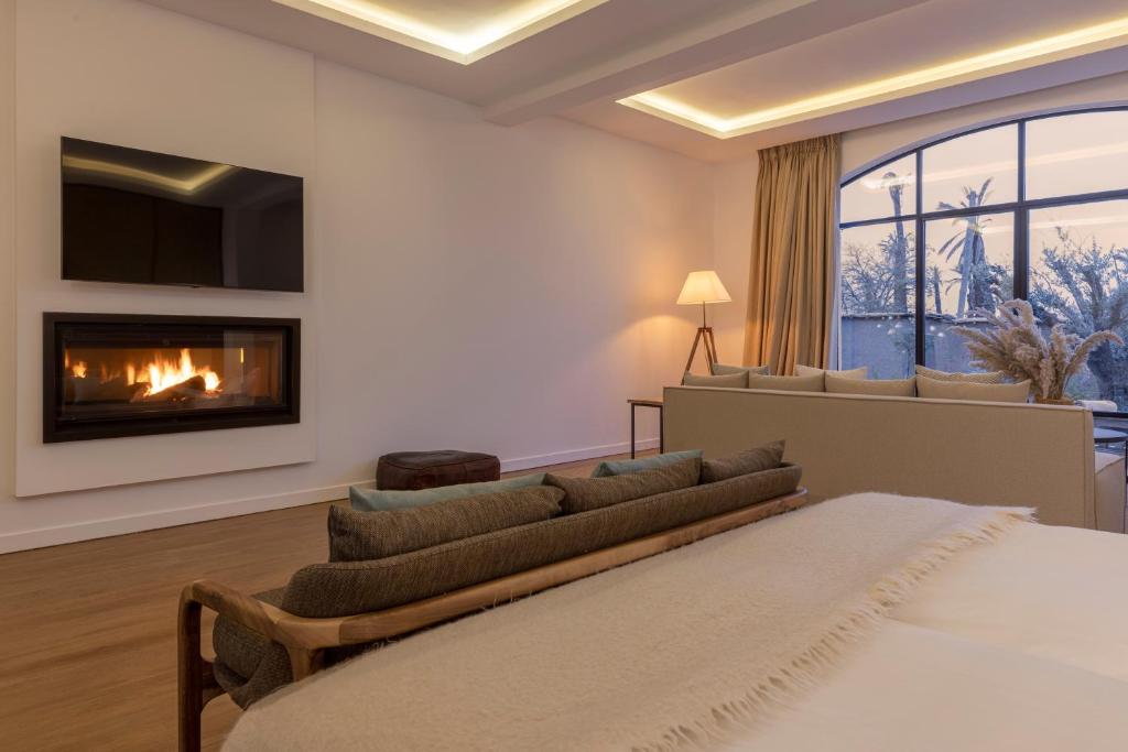 Postel nebo postele na pokoji v ubytování Ksar Char-Bagh Small Luxury Hotels