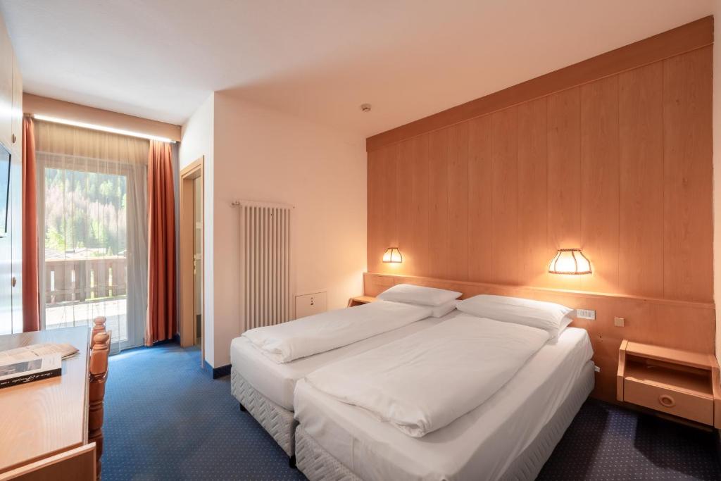 Łóżko lub łóżka w pokoju w obiekcie Hotel Grohmann