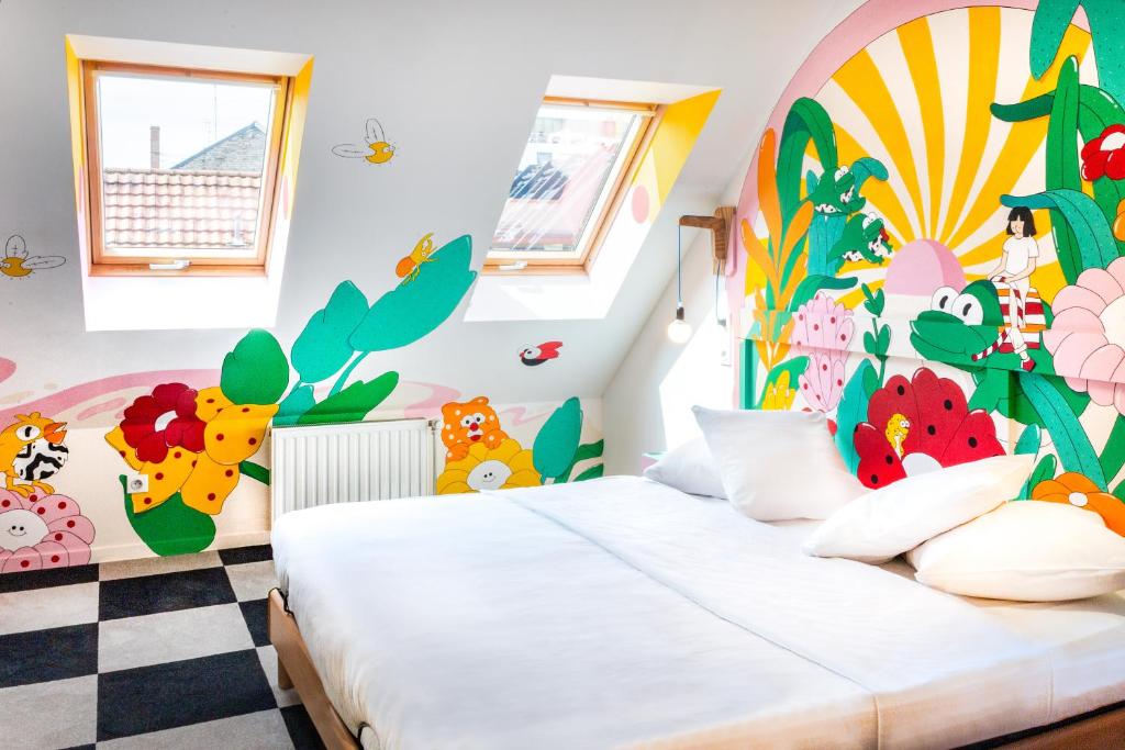 Postel nebo postele na pokoji v ubytování Hôtel Graffalgar