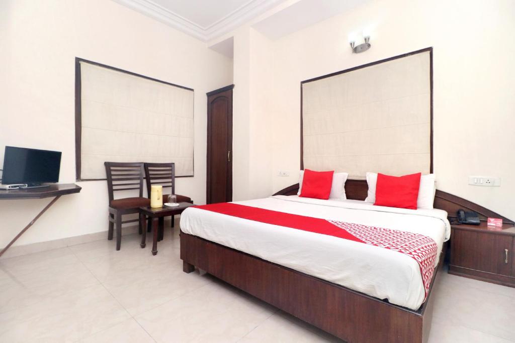 Cama o camas de una habitación en OYO Hotel Temple View